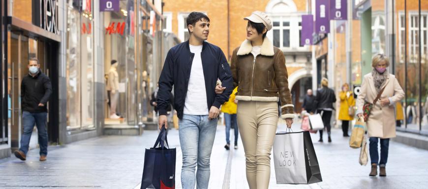 Couple in Cork City shopping at Opera Lane