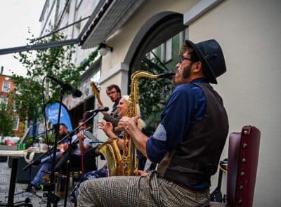Jazzy lunchtime: Pictured members of Jazz band, The Underscore Orkestra, entertaining the diners on Pembroke Street as part of Cork on a Fork Festival. The foodie street which features Sketch at the Imperial Hotel, The Bookshelf, Orso, Arthur Maynes , Cantys and Counihans . For more see www.corkonaforkfest.ie   Picture by Chani Anderson; www.capturesbychani.com Cork City 16/08/2023