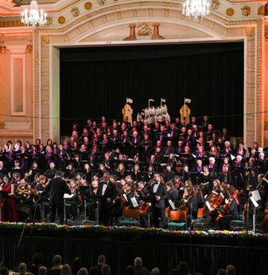 Grand concert hall featuring elegant architecture and live orchestra, offering guests a luxurious and cultural experience.